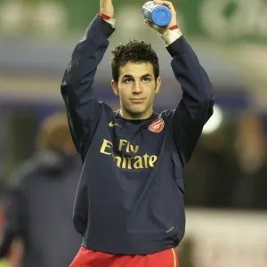 Cesc Fabregas waves to the Arsenal fans after the match