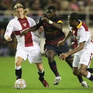 Champions Clash: Kolo Toure, Seydou Keita, and Christian Poulsen in Seville's 3-1 Victory over Arsenal, UEFA Champions League, Group H Champions Clash: Kolo Toure, Seydou Keita, and Christian Poulsen in Seville's 3-1 Victory over Arsenal, UEFA Champions League, Group H
