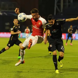 Champions Clash: Olivier Giroud vs. Leonardo Taravel - Arsenal's Star Forward Faces Off Against Dinamo Zagreb's Defender in the 2015-16 UEFA Champions League