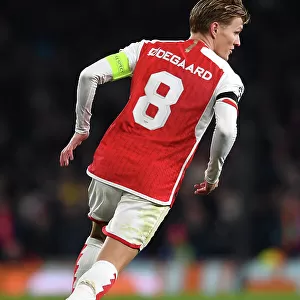 Charging Ahead: Martin Odegaard's Determined Push in Arsenal's UEFA Champions League Battle against RC Lens