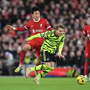Clash at Anfield: Liverpool vs. Arsenal, Premier League 2023-24 - Martin Odegaard vs. Wataru Endo Battle Clash at Anfield: Liverpool vs. Arsenal, Premier League 2023-24 - Martin Odegaard vs. Wataru Endo Battle