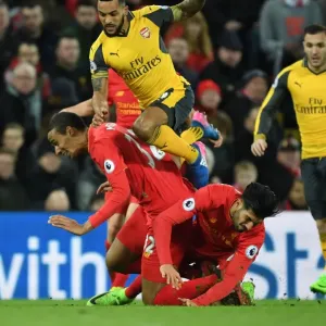 Clash at Anfield: Walcott's Intense Battle Against Matip and Can Clash at Anfield: Walcott's Intense Battle Against Matip and Can