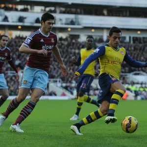 Clash at the Boleyn: Sanchez vs. Tomkins in the 2014-15 West Ham United vs. Arsenal Premier League Match