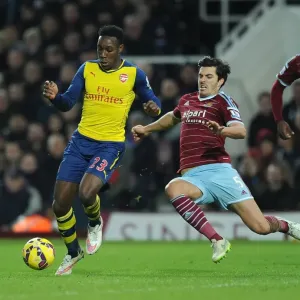 Clash at the Boleyn: Welbeck vs. Tomkins in the 2014-15 West Ham United vs. Arsenal Premier League Battle