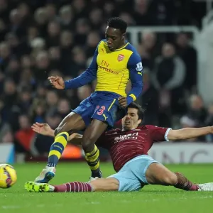 Clash at the Boleyn: Welbeck vs. Tomkins - A Battle in the 2014-15 West Ham United vs. Arsenal Premier League Match