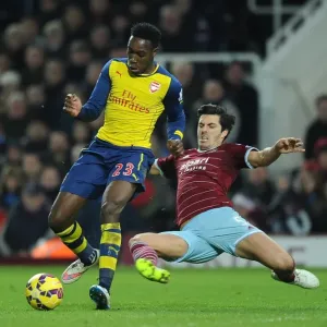 Clash at the Boleyn: Welbeck vs. Tomkins in the West Ham United vs. Arsenal Premier League Battle