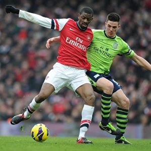 Clash at Emirates: A Battle for Midfield Supremacy - Abou Diaby vs. Ciaran Clark