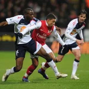 Clash of Forces: Oxlade-Chamberlain vs. Muamba in Premier League Battle Clash of Forces: Oxlade-Chamberlain vs. Muamba in Premier League Battle