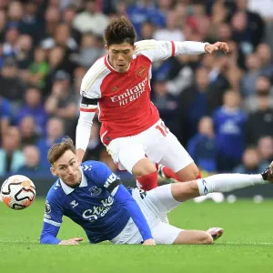 Clash at Goodison Park: Arsenal's Tomiyasu Faces Off Against Everton's Garner (2023-24)