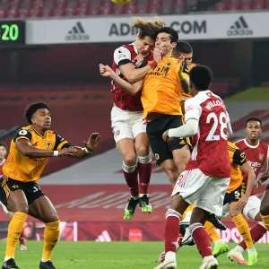 Clash of Heads: David Luiz vs. Raul Jimenez - Arsenal vs. Wolverhampton Wanderers, Empty Emirates Stadium, Premier League 2020-21 Clash of Heads: David Luiz vs. Raul Jimenez - Arsenal vs. Wolverhampton Wanderers, Empty Emirates Stadium, Premier League 2020-21