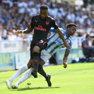 Clash at John Smiths: Lacazette vs. Kongolo in Premier League Showdown Clash at John Smiths: Lacazette vs. Kongolo in Premier League Showdown