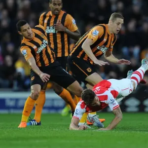 Clash at KC Stadium: Olivier Giroud vs. Hull City's Jake Livermore and Michael Dawson