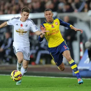 Clash at Liberty: Gibbs vs Carroll in Swansea v Arsenal Premier League Showdown Clash at Liberty: Gibbs vs Carroll in Swansea v Arsenal Premier League Showdown