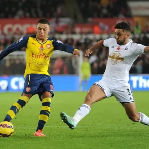 Clash at Liberty: Oxlade-Chamberlain vs Taylor - Arsenal vs Swansea, Premier League 2014: A Battle Between Two Stars