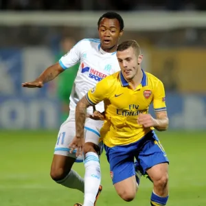 Clash of Midfield Maestros: Jack Wilshere vs. Jordan Ayew, Marseille vs. Arsenal, UEFA Champions League, 2013 Clash of Midfield Maestros: Jack Wilshere vs. Jordan Ayew, Marseille vs. Arsenal, UEFA Champions League, 2013