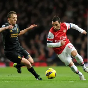 Print of Santi Cazorla vs Lucas Leiva in action Print of Santi Cazorla vs Lucas Leiva in action