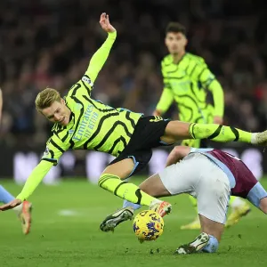 Clash of Midfield Titans: Odegaard vs McGinn in Aston Villa vs Arsenal FC (2023-24) Clash of Midfield Titans: Odegaard vs McGinn in Aston Villa vs Arsenal FC (2023-24)