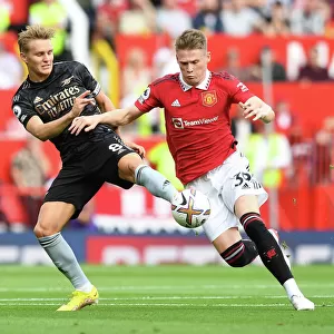 Clash of the Midfield Titans: Odegaard vs McTominay - A Premier League Showdown (Manchester United vs Arsenal, 2022-23)