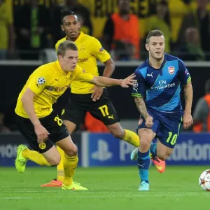 Clash of Midfield Titans: Wilshere vs. Ginter in Borussia Dortmund vs. Arsenal, UEFA Champions League