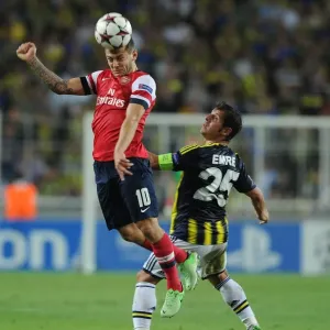 Clash of Midfield Titans: Wilshere vs. Belozoglu - Arsenal vs. Fenerbahce, UEFA Champions League Play-offs, Istanbul, Turkey, 2013