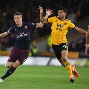 Clash at Molineux: Koscielny vs. Jimenez in Premier League Showdown (Wolverhampton Wanderers vs. Arsenal FC, 2018-19)