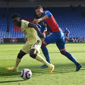 Clash at Selhurst Park: Bukayo Saka Faces Off Against Joel Ward in Premier League Showdown (Crystal Palace vs Arsenal, 2020-21)