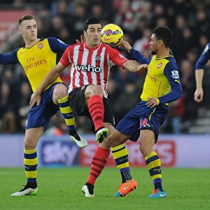 Clash at St. Mary's: Arsenal's Chambers and Coquelin Battle Pelle of Southampton (2014-15)