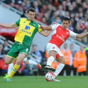 Clash of Stars: Alexis Sanchez vs. Jonny Howson in Arsenal's Battle Against Norwich Clash of Stars: Alexis Sanchez vs. Jonny Howson in Arsenal's Battle Against Norwich