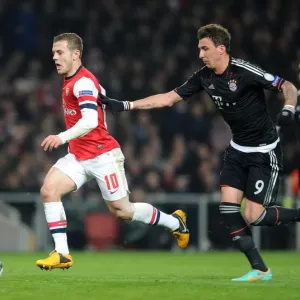 Clash of Stars: Jack Wilshere vs. Mario Mandzukic in Intense Arsenal-Bayern Champions League Showdown