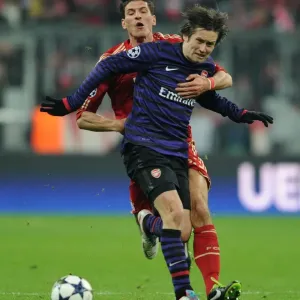 Clash of Stars: Rosicky vs. Gomez - Intense Battle at Allianz Arena (Arsenal vs. Bayern Munich, 2012-13 Champions League)