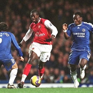 Clash of Titans: Adebayor, Carvalho, and Essien Face Off in the 1:1 Battle at Stamford Bridge, FA Premiership, 10/12/06