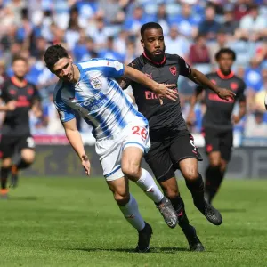 Clash of Titans: Lacazette vs. Schindler in Huddersfield Derby Clash of Titans: Lacazette vs. Schindler in Huddersfield Derby