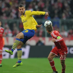 Clash of Titans: Lukas Podolski vs. Philipp Lahm - FC Bayern Munich vs. Arsenal, UEFA Champions League Clash of Titans: Lukas Podolski vs. Philipp Lahm - FC Bayern Munich vs. Arsenal, UEFA Champions League