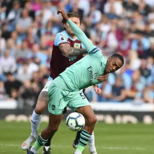 Clash at Turf Moor: Burnley vs. Arsenal - Premier League Showdown (2018-19) - Intense Battle between Joe Willock and Jeff Hendrick