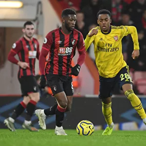 Clash at Vitality: Arsenal's Willock Tackles Bournemouth's Lerma in Premier League Showdown