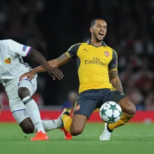 Clash of Wings: Theo Walcott vs. Adama Traore in Arsenal's UEFA Champions League Showdown against FC Basel Clash of Wings: Theo Walcott vs. Adama Traore in Arsenal's UEFA Champions League Showdown against FC Basel