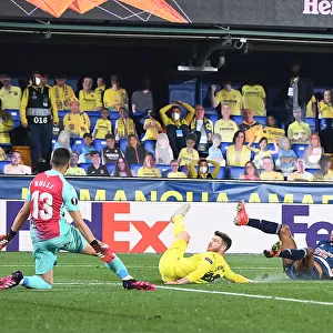 Behind Closed Doors: Aubameyang's Saved Shot - Arsenal vs. Villarreal in UEFA Europa League Semi-Final: Aubameyang's Dramatic Miss as Arsenal Battle Villarreal in Empty Stadiums