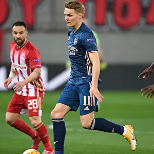 Behind Closed Doors: Martin Odegaard's UEFA Europa League Debut for Arsenal against Olympiacos, Greece