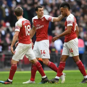 Consoling Aubameyang: A Moment of Empathy Between Xhaka and Arsenal Teammate Amidst Rivalry