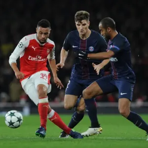 Coquelin Under Fire: Arsenal's Midfielder Battles Meunier and Moura in Intense Arsenal vs. Paris Saint-Germain Champions League Clash Coquelin Under Fire: Arsenal's Midfielder Battles Meunier and Moura in Intense Arsenal vs. Paris Saint-Germain Champions League Clash