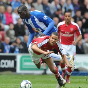 Craig Eastmond (Arsenal) Mohamed Diame (Wigan). Wigan Athletic 3: 2 Arsenal