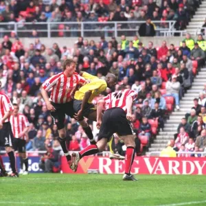 Danny Collins (Sunderland) heads into his own goal under pressure from Abu Diaby for the 1st Arsenal