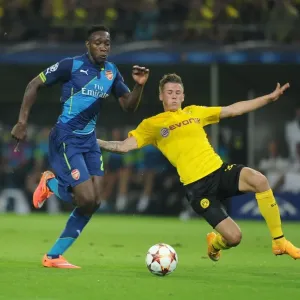 Danny Welbeck vs. Eric Durm: A Battle in the UEFA Champions League between Borussia Dortmund and Arsenal
