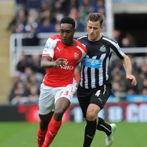 Danny Welbeck vs. Ryan Taylor: Intense Battle in Newcastle United vs. Arsenal Premier League Clash