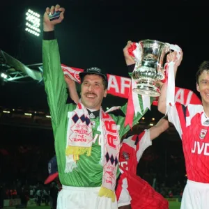 David Seaman and David O Leary hold aloft the FA Cup Trophy after the game