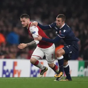 Debuchy vs. Krsticic: A Europa League Battle at Emirates Stadium