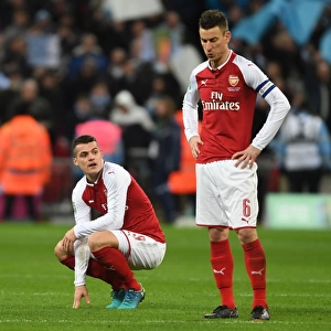 Dejected Duo: Xhaka and Koscielny After Arsenal's Carabao Cup Final Defeat vs Manchester City