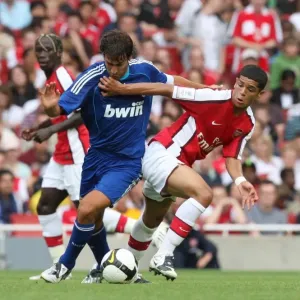 Denilson (Arsenal) Raul (Real)
