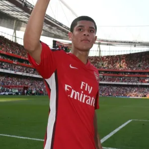 Denilson (Arsenal) waves to the fans after the match