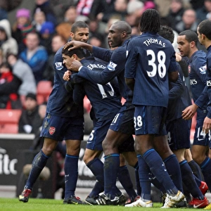 Denilson celebrates scoring Arsenals goal with Armand Traore and Sol Campbell